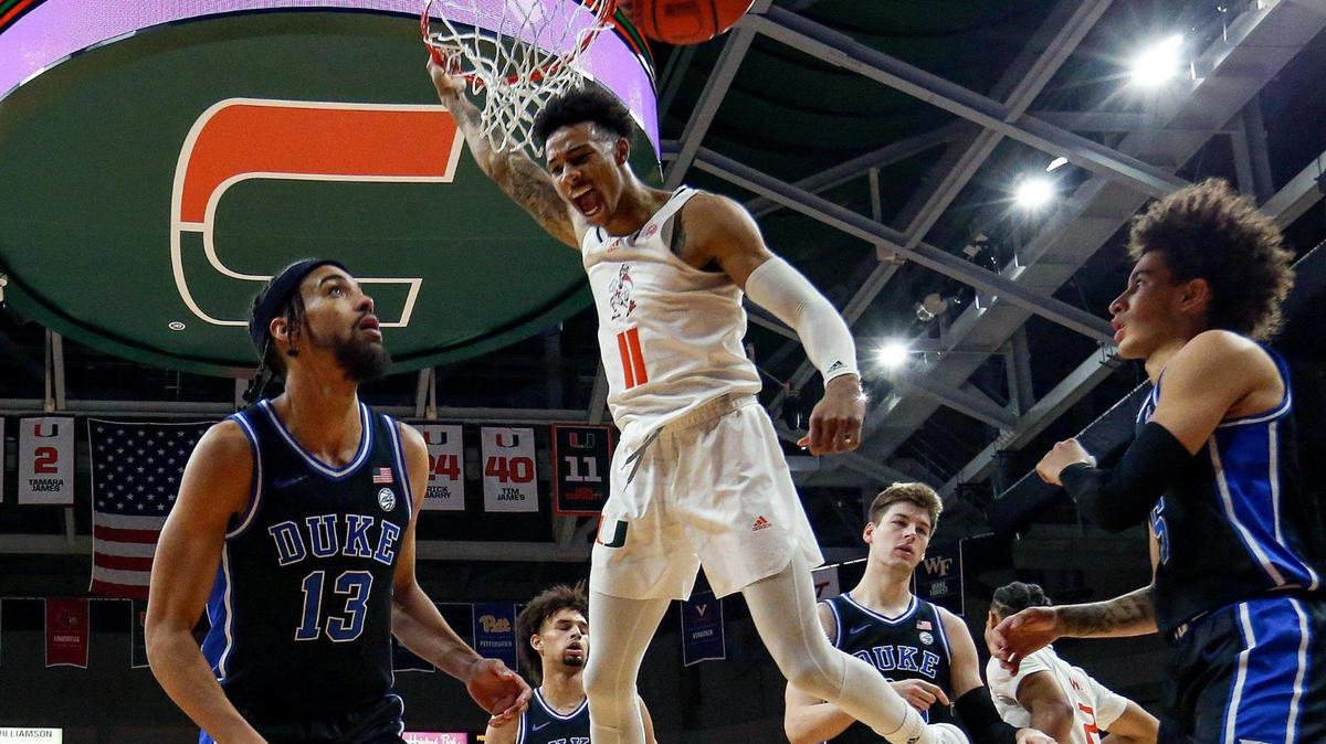 Miami Hurricanes guard Jordan Miller (11) dunks the ball over Duke Blue Devils guard Jacob Grandison (13) in the first half at the Watsco Center in Coral Gables, Florida on Monday, February 6, 2023.