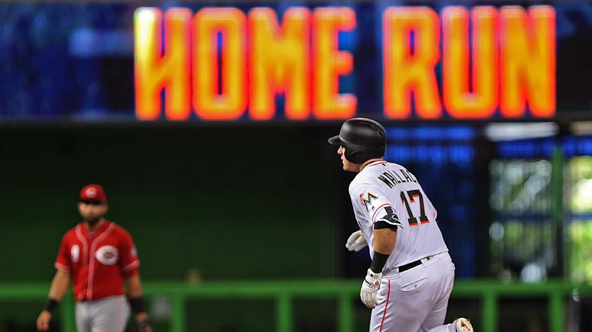 Marlins catcher Chad Wallach hits a three-run home run in the third inning as the Miami Marlins host their final home game of the season against the Cincinnati Reds on Sunday, September 23, 2018.