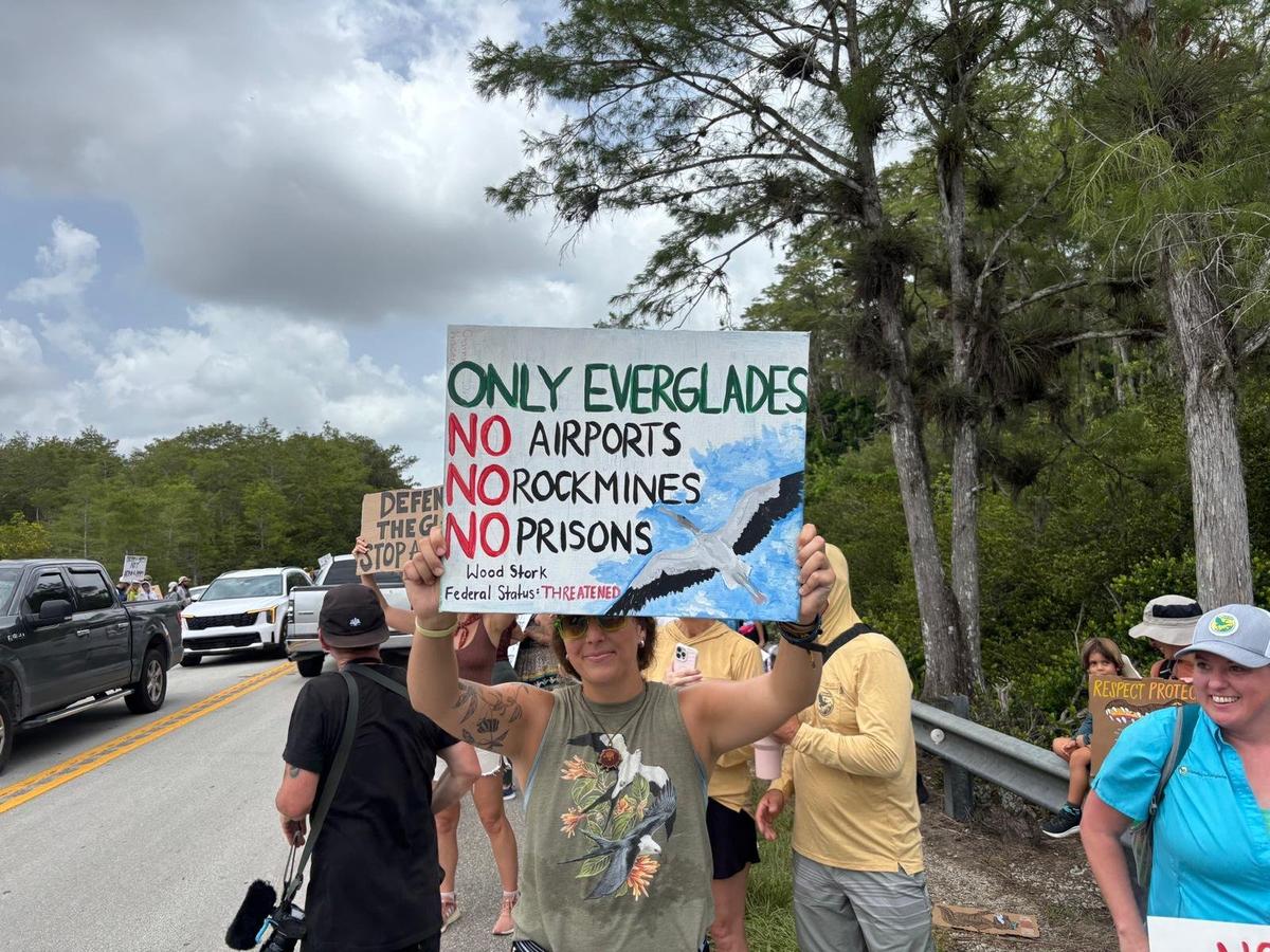 Ochopee, Florida, June 28, 2025 - Protesters rally near Dade-Collier Training and Transition Airport where a migrant detention center is being built. The center, which is being called “Alligator Alcatraz,” is in the middle of the Everglades. Protesters argue the detention center could damage the fragile ecosystem of the area.