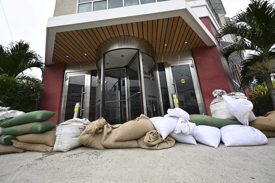 Sandbags are placed at the entrance of the Grace Kennedy building in preparation for the arrival of Hurricane Melissa in downtown Kingston, Jamaica, on October 25, 2025. Deadly storm Melissa strengthened Saturday afternoon into a Category 1 hurricane, with rapid intensification expected over the weekend as it cut a worryingly slow course toward the Caribbean island of Jamaica, forecasters said. (Photo by Ricardo Makyn / AFP) (Photo by RICARDO MAKYN/AFP via Getty Images)          