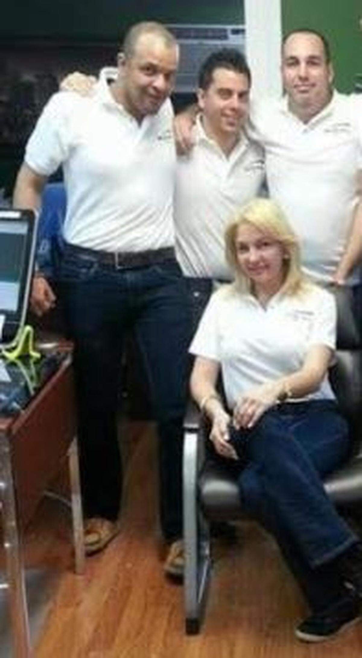 Standing from left to right, Billing USA convicted fraudsters Francel Rodriguez, Sergio Carratala and Rafael Izquierdo-Rios. The woman sitting was not charged with any crimes.