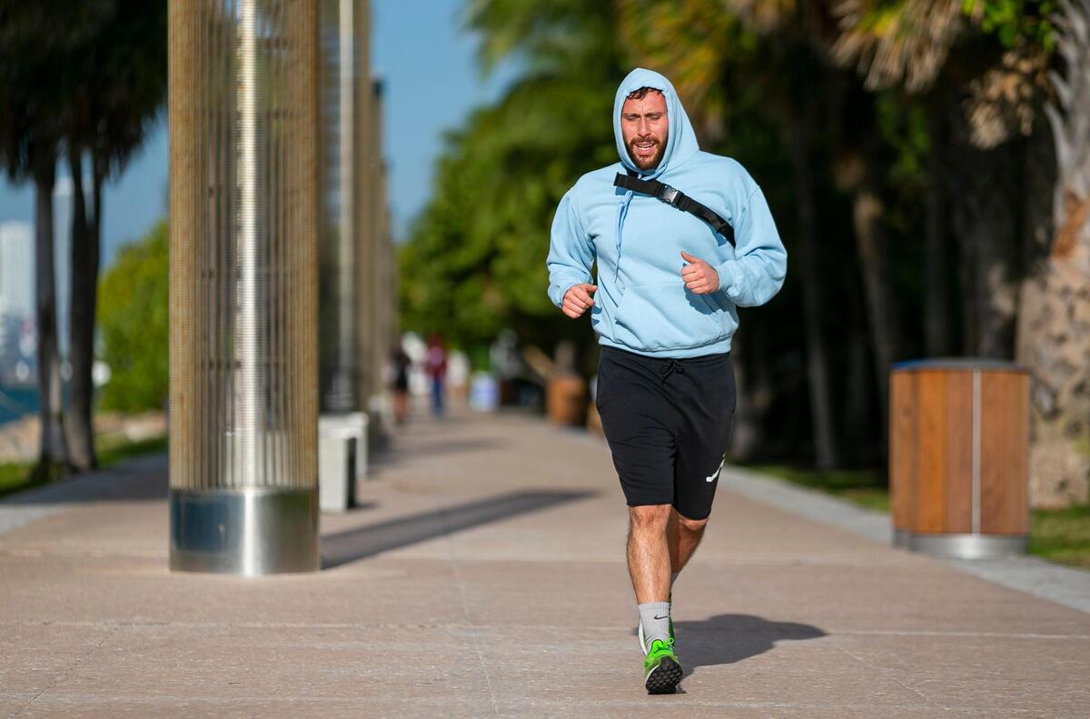 A runner makes his way toward South Pointe Park in Miami Beach as temperatures dip into the low 50s across South Florida on Saturday, January 29, 2022.