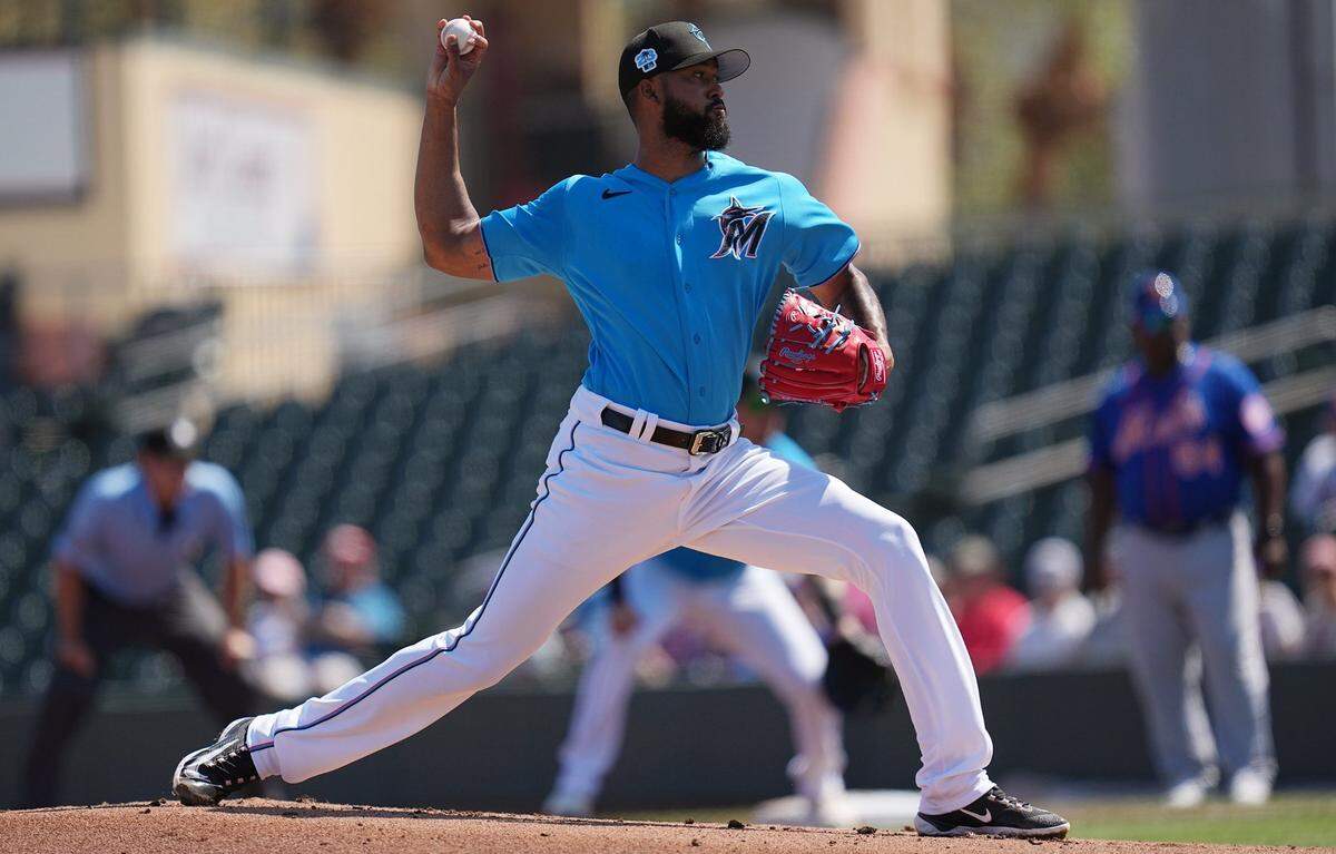 Mar 1, 2023; Jupiter, Florida, USA; Miami Marlins starting pitcher Sandy Alcantara (22) pitches against the New York Mets in the first inning at Roger Dean Stadium. Mandatory Credit: Jim Rassol-USA TODAY Sports