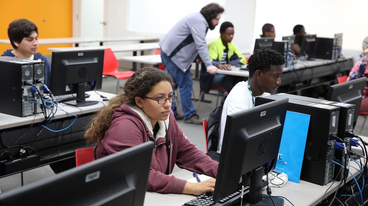 Katie Altamirano, 15, (L) and Darius Thomas, 17, work on a coding challenge that is part of a web development class at the Big Brothers Big Sisters of Greater Miami campus Monday, July 9, 2018.