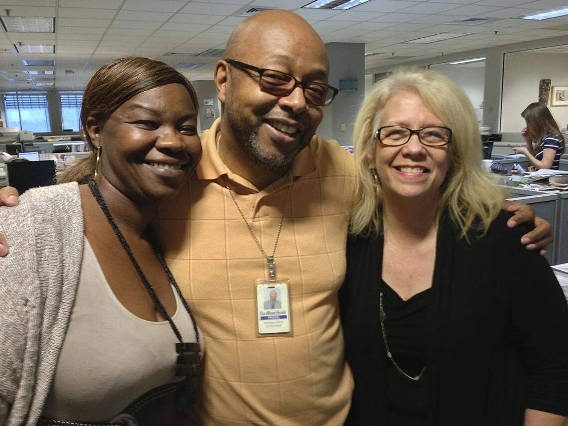 Miami Herald Haiti and Caribbean reporter Jacqueline Charles, retired columnist Leonard Pitts Jr. and former theater critic Christine Dolen gathered at a farewell party to the paper’s Biscayne Bay-fronting building at 1 Herald Plaza in this March 20, 2013, photo from inside the newsroom that served as the staff’s home from 1963 to 2013.