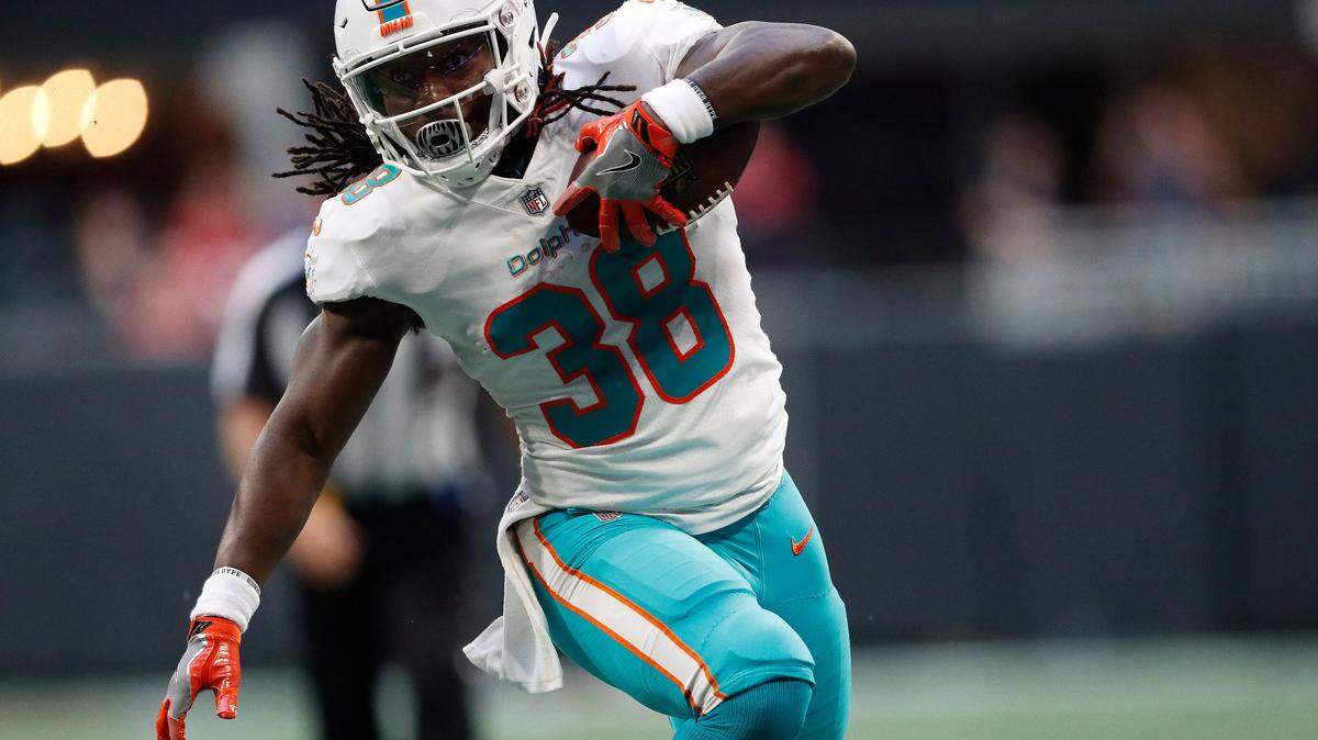 Miami Dolphins running back Buddy Howell runs against the Atlanta Falcons during the first half of Thursday night’s preseason finale.