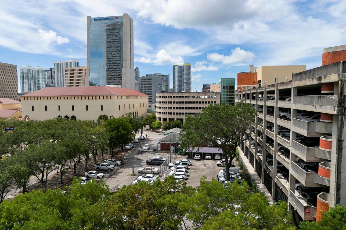 Miami-Dade County is offering public land and buildings surrounding its Stephen P. Clark Government Center tower to developers as part of a plan to create a new downtown neighborhood. The properties up for bid include the county motorpool lot and gas station at center, the two adjacent garages and the Miami-Dade Main Library and Cultural Center, at left, which would be demolished and replaced. The tower would remain.