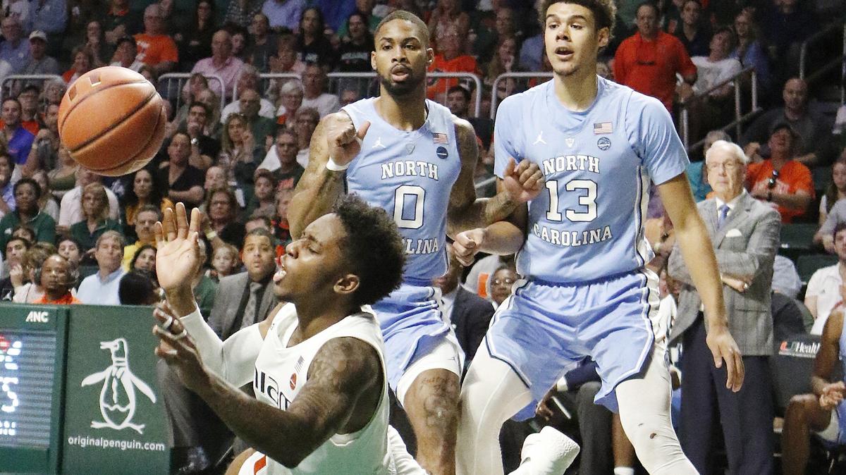 UM Hurricanes’ Chris Lykes (0) battling for the ball against the North Carolina Tar Heels on Saturday, Jan. 19, 2019 at Watsco Center in Coral Gables.