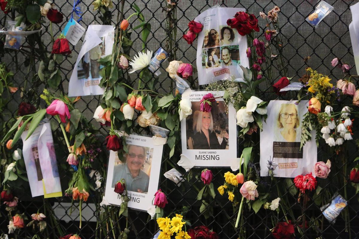 A growing memorial wall of flowers and photos at the intersecition of 88th St. and Harding Ave near the collapsed Champlain Towers South Condo at 8777 Collins Ave in Surfside June 28, 2021.
