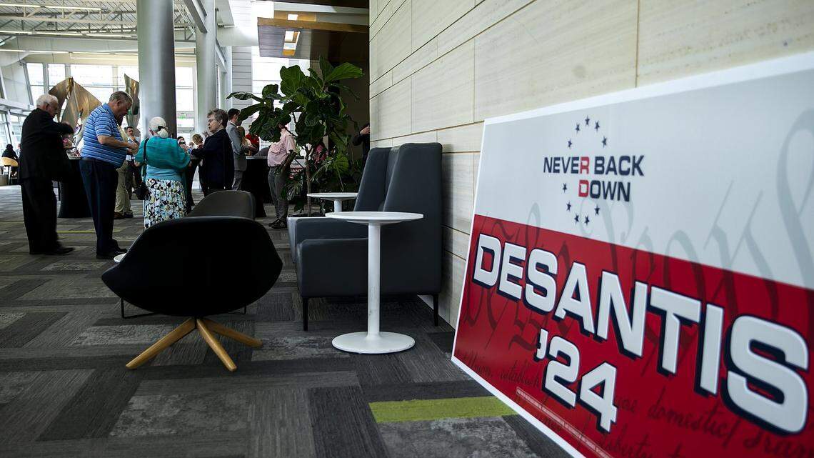 May, 14, 2023; Cedar Rapids, IA, USA; A sign for Florida Gov. Ron DeSantis reading “Never back down” is seen during an Iowa GOP reception, Saturday, May 13, 2023, at The Hotel at Kirkwood Center in Cedar Rapids, Iowa. Mandatory Credit: Joseph Cress-USA TODAY NETWORK