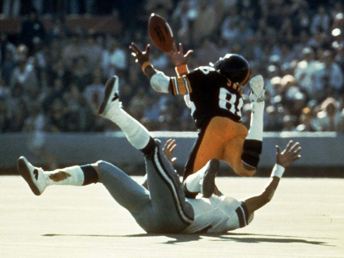 Pittsburgh Steelers wide receiver Lynn Swann (88) dives as he catches a pass from quarterback Terry Bradshaw during Super Bowl X at the Orange Bowl in this Miami, Fla., in this Jan. 18, 1976 photo. Swann was one of seven elected into the Pro Football Hall of Fame, Saturday, Jan. 27, 2001.