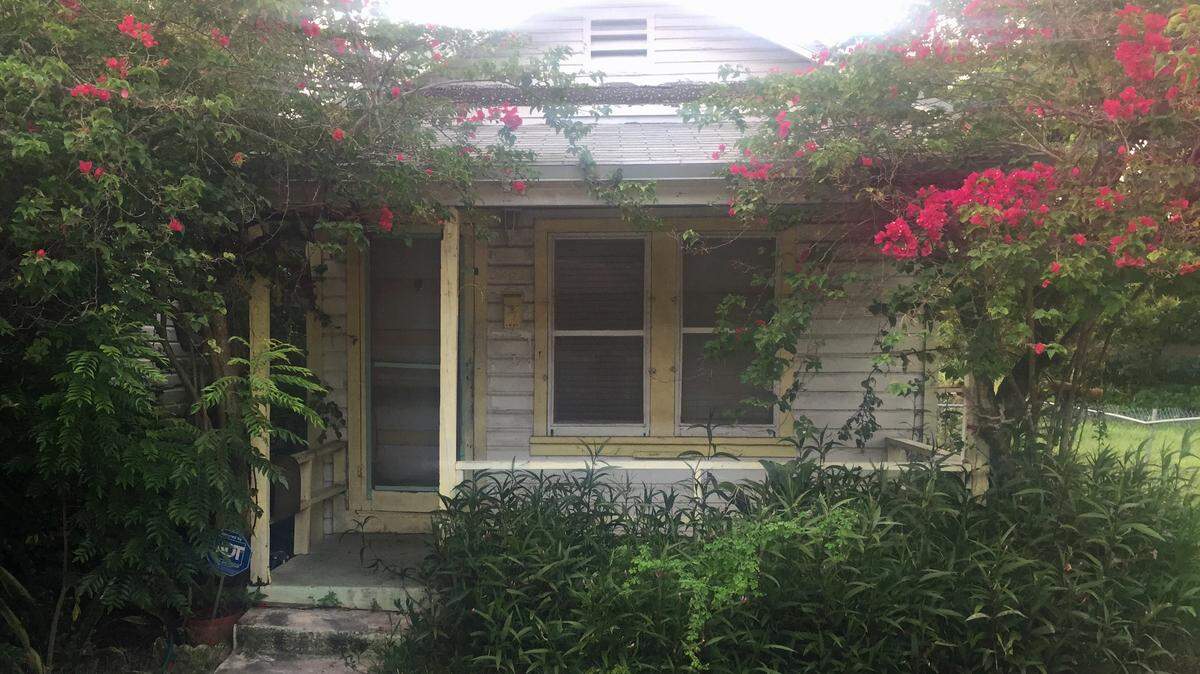 One of the adjoining “shotgun” houses purchased by developer Andrew Rasken on Charles Avenue. The houses were designated as historic structures in July.