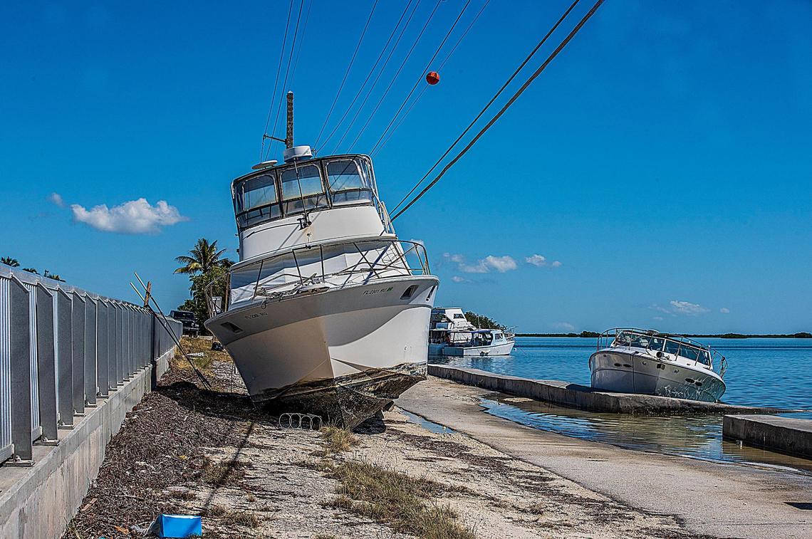A boat named Dream Catcher sits next to Florida Keys Overseas Highway on Sugarloaf Key Thursday, Oct. 27, 2022. The vessel ran aground during Hurricane Ian, a Category 4 hurricane that passed the Florida Keys Tuesday, Sept. 27, 2022, before making a direct hit on the southwest coast the next day.