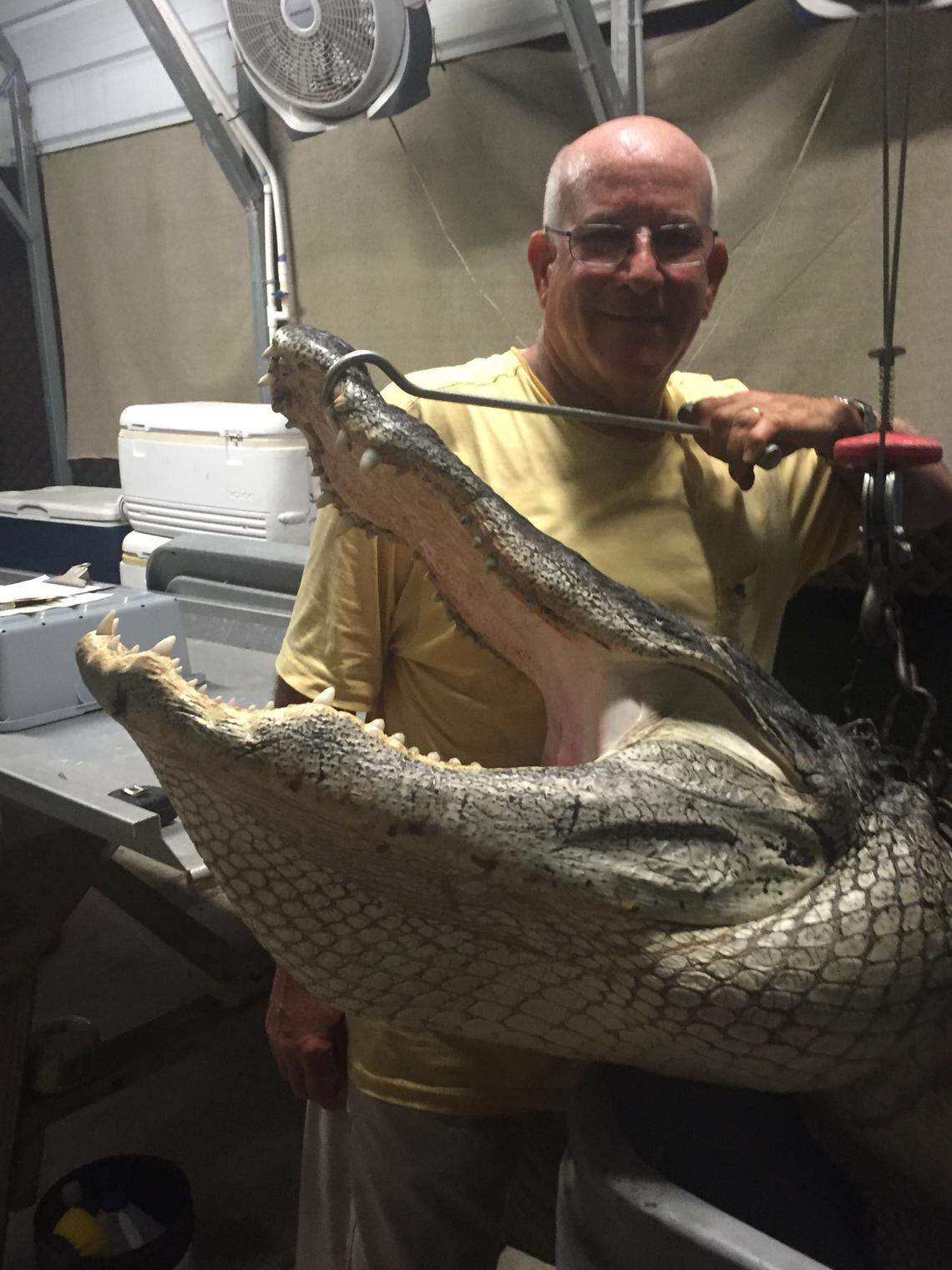Cooper City resident Jim Howard snagged a 12-foot alligator from Lake Okeechobee Aug. 16, 2018.