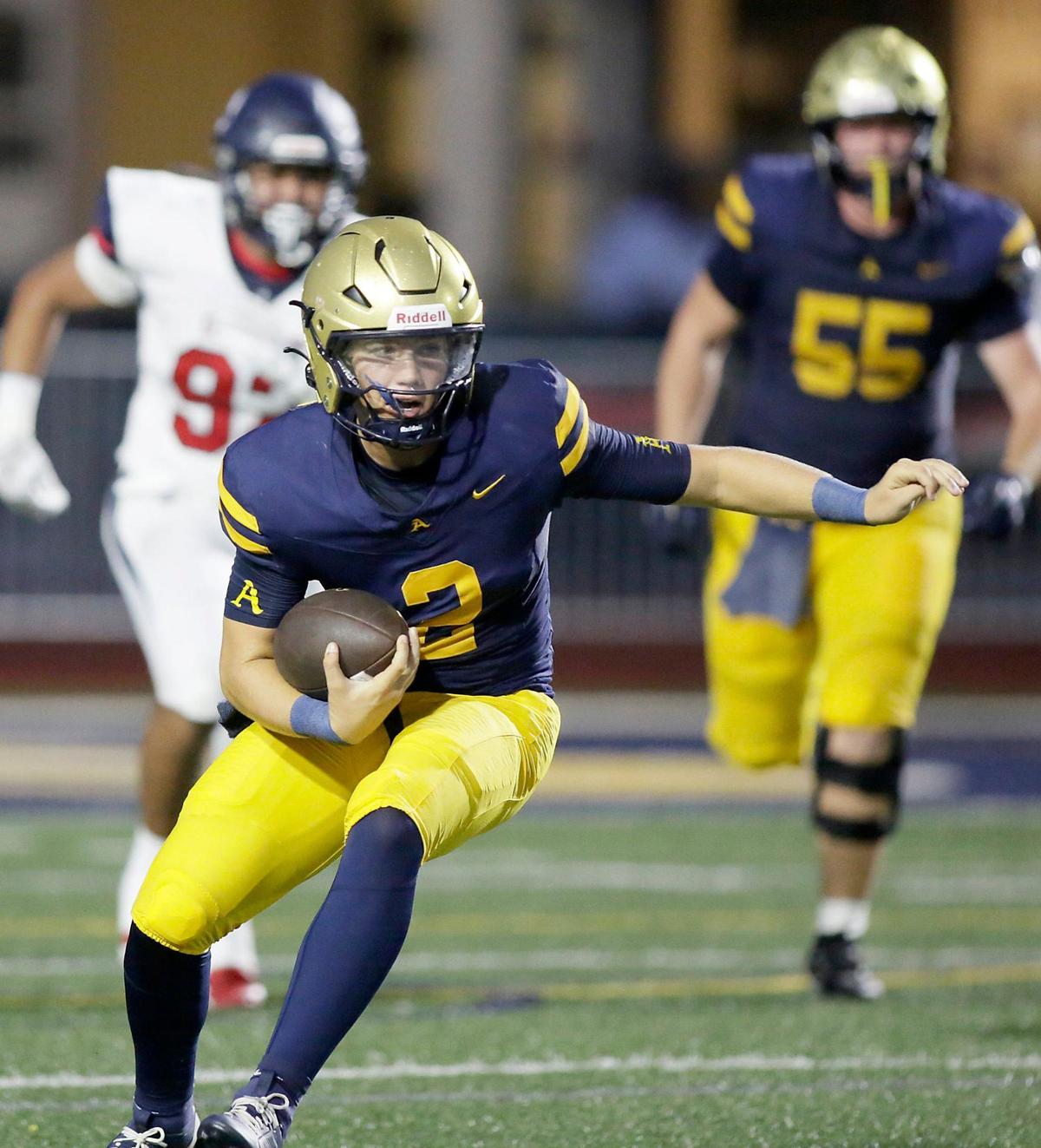 St. Thomas Aquinas Raiders quarterback Andrew Indorf (2) carries the ball against Columbus Explorers during football game on Friday, September 6, 2024 at St. Thomas Aquinas HS in Fort Lauderdale.
