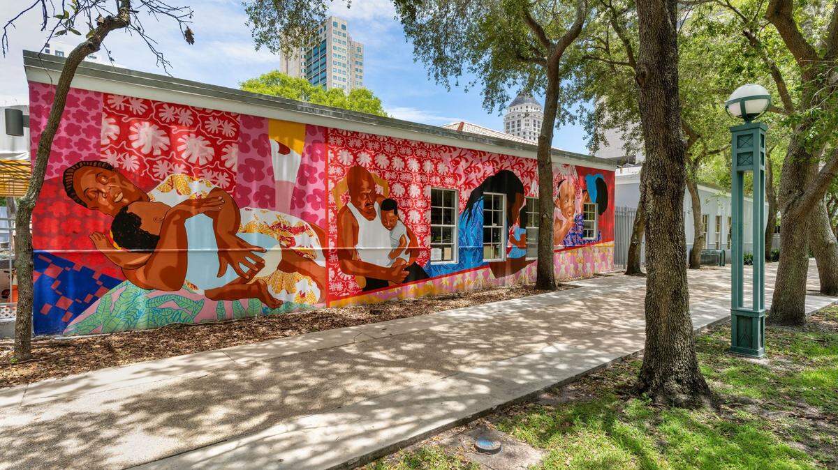 Mark Fleuridor’s “Being Held” mural covers one wall at the Carol Glassman Donaldson Childcare Center, across from the Miami-Dade Children’s Courthouse. 