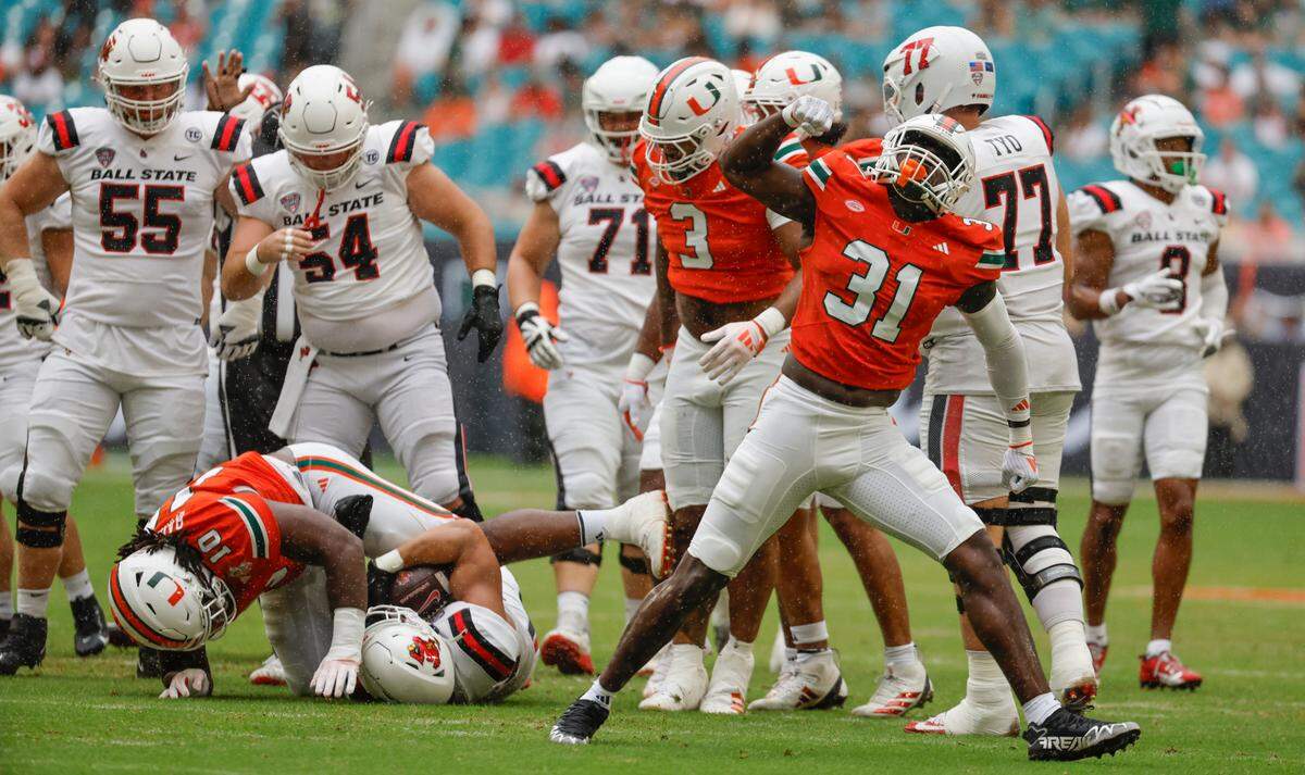 Miami Hurricanes linebacker Wesley Bissainthe (31) reacts after the take down of Ball State Cardinals running back Vaughn Pemberton (23) in the first half of an NCAA football game at Hard Rock Stadium in Miami Gardens, Florida on Saturday, September 14, 2024. 