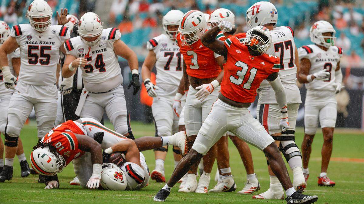 Miami Hurricanes linebacker Wesley Bissainthe (31) reacts after the take down of Ball State Cardinals running back Vaughn Pemberton (23) in the first half of an NCAA football game at Hard Rock Stadium in Miami Gardens, Florida on Saturday, September 14, 2024. 
