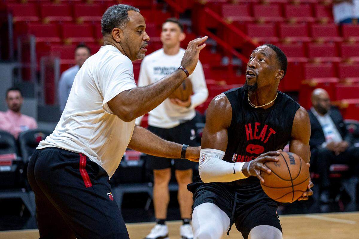 Miami Heat center Bam Adebayo (13) looks to shoot the ball over assistant coach Malik Allen during warm ups before the start of Game 1 of a second round NBA Eastern Conference semifinal playoff series against the Philadelphia 76ers at FTX Arena in Miami on May 2, 2022.