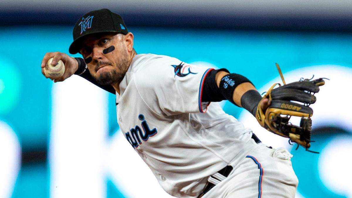 Miami Marlins short stop Miguel Rojas (11) throws to first base for the double play during the first inning of an MLB game against the Chicago Cubs at loanDepot park in the Little Havana neighborhood of Miami, Florida, on Tuesday, September 20, 2022.