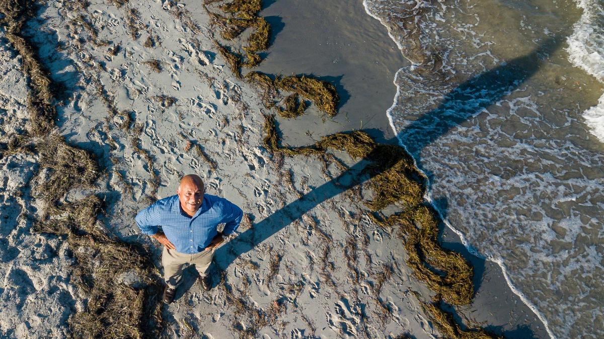 Roland Samimy, the first chief resilience officer for Key Biscayne, visits the beach in Key Biscayne, Florida, on Tuesday, September 1, 2020.
