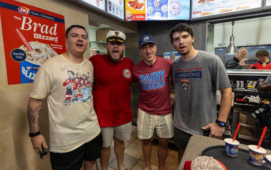 Florida Panthers center Brad Marchand poses for a photo with fans Kyle Leclerc, Trace Hodges, and Justin McCarthy during a surprise visit to Dairy Queen in Sunrise, Florida, on Friday, June 20, 2025, as part of the team’s Stanley Cup victory celebration.