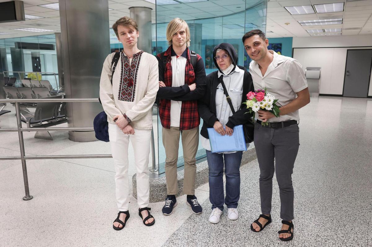 From left to right: Roman Zhenzhirov, his brother, Arsenii, 17, his mother, Nataliia Zhenzhirova, and his husband, Roman Shyshkin, pose after his brother and mother entered the U.S. on Tuesday, June 21, 2022, at Miami International Airport. Arsenii and Nataliia evacuated their city of Zhashkiv in central Ukraine and fled to Romania, Poland and then Germany. They entered the U.S. as part of President Biden’s Uniting for Ukraine.