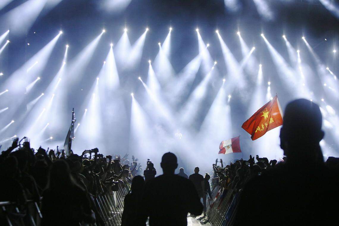 Flags waving amid the lights on the final night of Ultra Music Festival on Virginia Key in 2019.