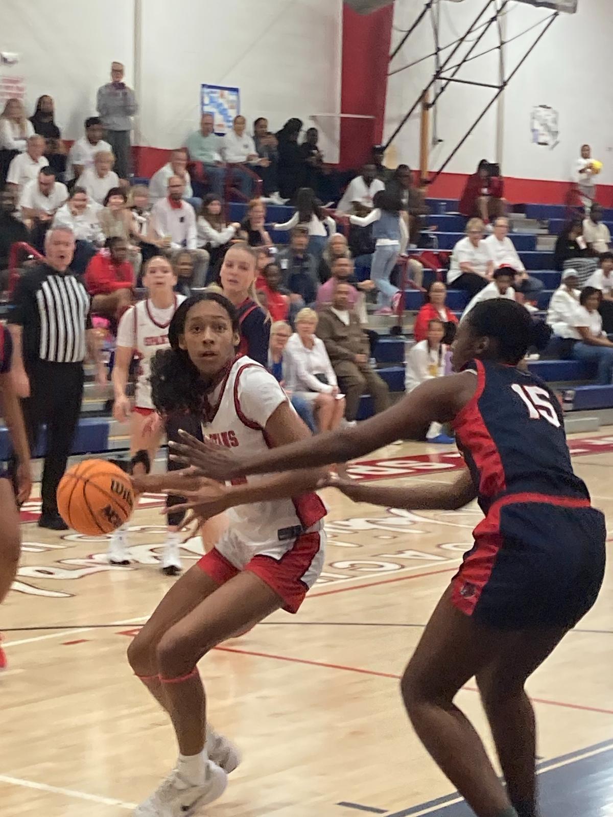 Miami Country Day’s Rachel Luis drives to the basket as Westminster Academy’s Alison Williams tries to defend during Friday’s Region 4-2A girls’ basketball final at Miami Country Day.