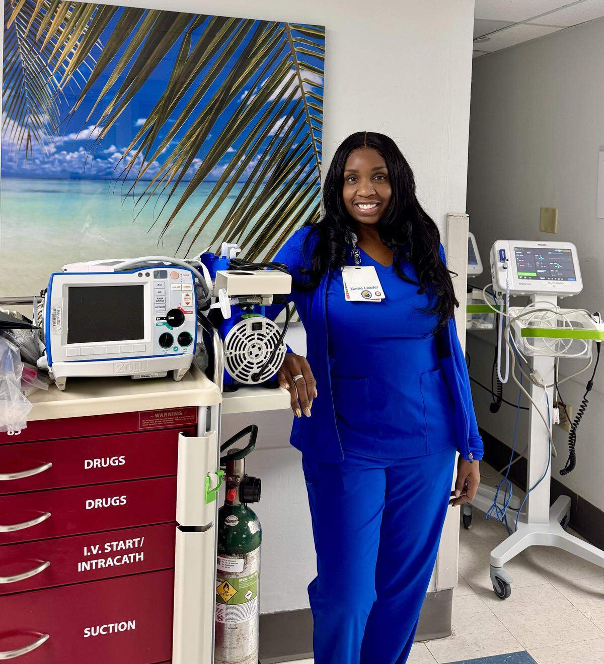 Tamika Luciano at Jackson Memorial Hospital, surrounded by the lifesaving equipment she uses every day. Despite having multiple sclerosis, she continues to work and wants to pursue a nurse practitioner master’s degree.