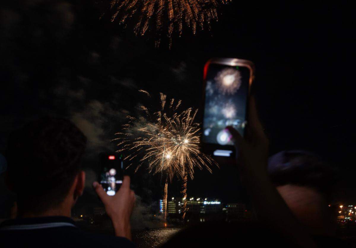 Attendees watch the fireworks during the Fourth of July Bayfront Park Celebration at Bayfront Park on Tuesday, July 4, 2023 in Miami, Fla.