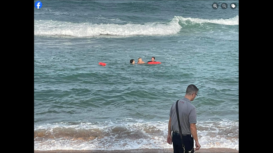 The swimmers were caught in a dangerous rip current that was pulling them out to sea.
