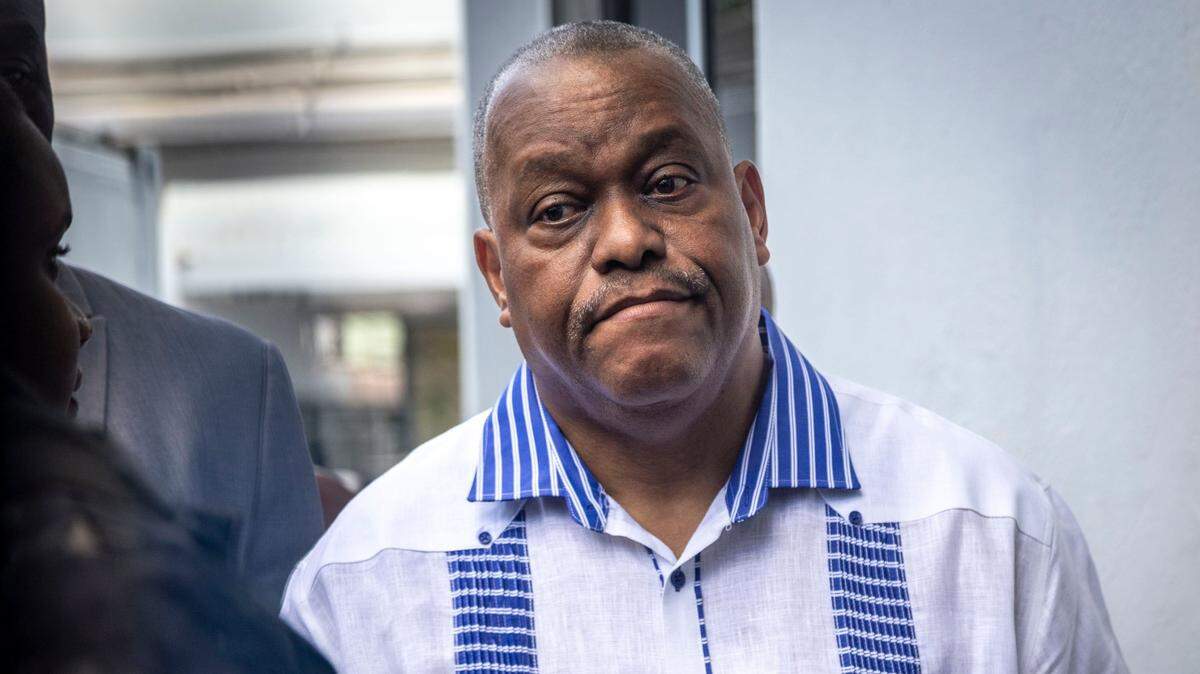 Haitian Prime Minister Gary Conille arrives at Hospital Bernard Mevs to visit Haitian police officers who have been wounded while battling gangs in Port-au-Prince.