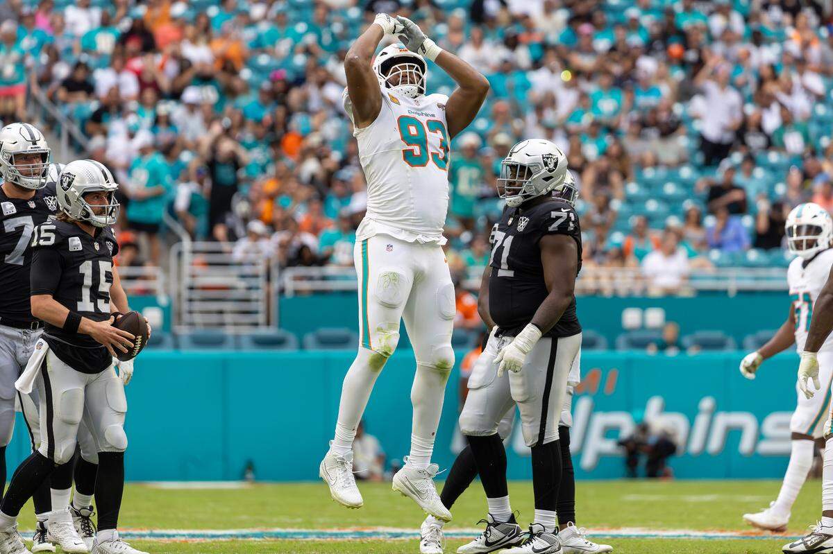 Miami Dolphins defensive tackle Calais Campbell (93) reacts after sacking Las Vegas Raiders quarterback Gardner Minshew (15) in the second half of their NFL game at Hard Rock Stadium on Sunday, Nov. 17, 2024, in Miami Gardens, Fla