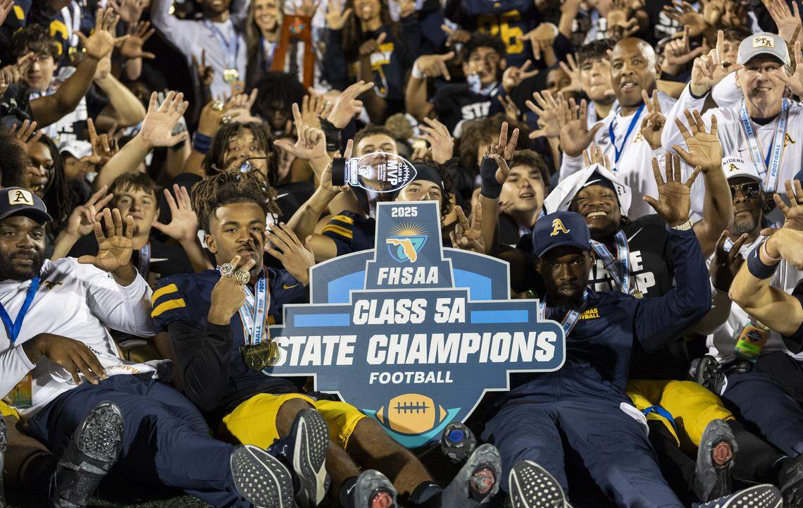 TEAM POSITION NAME (NUMBER) ACTION against TEAM POSITION NAME (NUMBER) in the NUMBER half of their Class 5A state championship football game at Pitbull Stadium on Thursday, Dec. 11, 2025, in Miami, Fla.