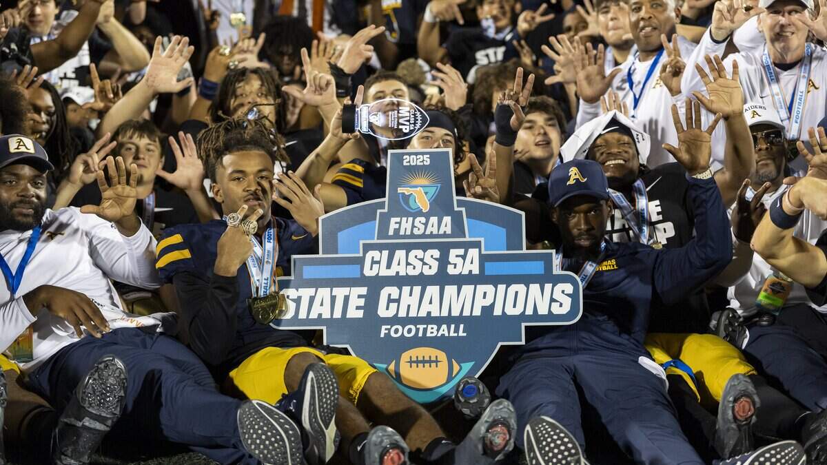 TEAM POSITION NAME (NUMBER) ACTION against TEAM POSITION NAME (NUMBER) in the NUMBER half of their Class 5A state championship football game at Pitbull Stadium on Thursday, Dec. 11, 2025, in Miami, Fla.