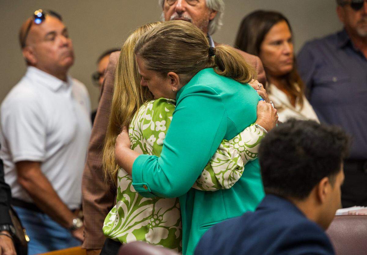 Prosecutor Kimberly Ann Rivera (right) hugs Lissette Rey, the wife of Jose Rey, who was shot and killed by Omar Rodriguez. Rodriguez was sentenced Thursday, Aug. 15, 2024, to a life in prison with a minimum of 25 years.