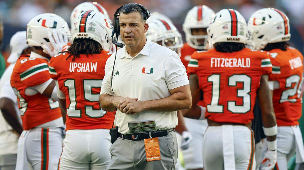Miami Hurricanes head coach Mario Cristobal on the field during a time out of an NCAA football game against the Syracuse Orange at Hard Rock Stadium in Miami Gardens, Florida on Saturday, November 8, 2025.