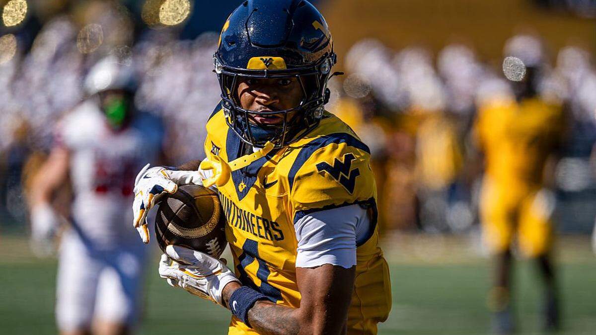 MORGANTOWN, WEST VIRGINIA - AUGUST 30: Cam Vaughn #4 of the West Virginia Mountaineers runs with the ball during a game against Robert Morris Colonials in the fourth quarter at Milan Puskar Stadium on August 30, 2025 in Morgantown, West Virginia. (Photo by Brien Aho/Getty Images)