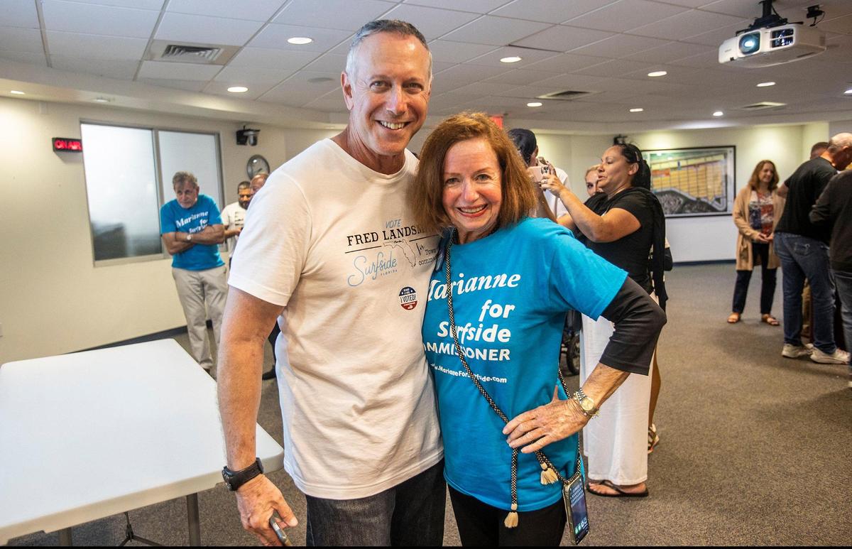 Newly elected Surfside commissioners Marianne Meischeid and Fred Landsman celebrate at Town Hall, on Tuesday March 15, 2022,