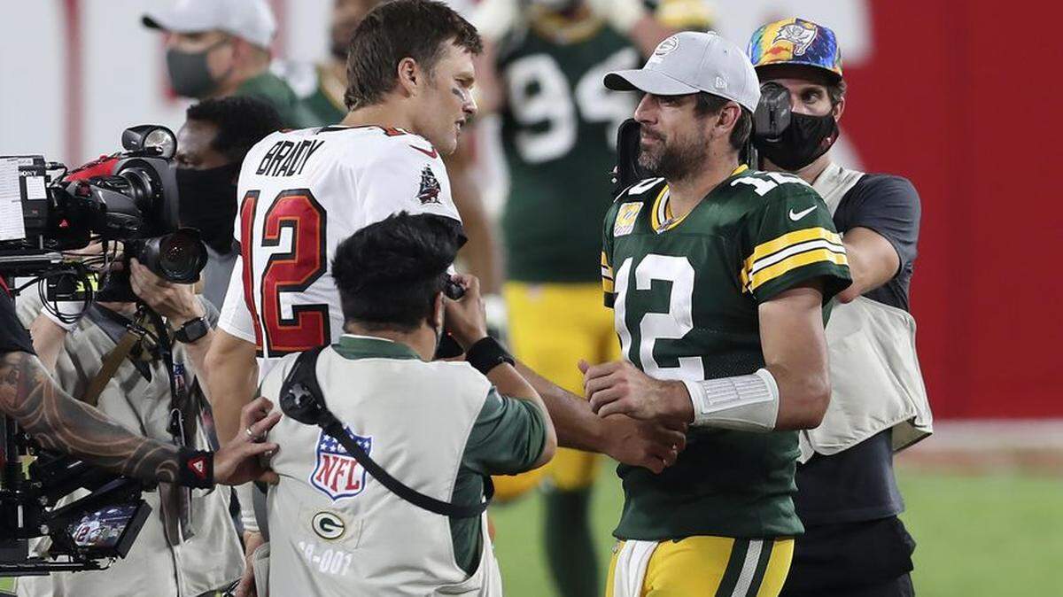 Summit of G.O.A.Ts: Tampa Bay’s Tom Brady (left) and Green Bay’s Aaron Rodgers meet after last season’s NFC Championship Game. Rodgers wins Week 14 in Herald’s NFL QB rankings, while Brady is comfortably No. 1 overall.