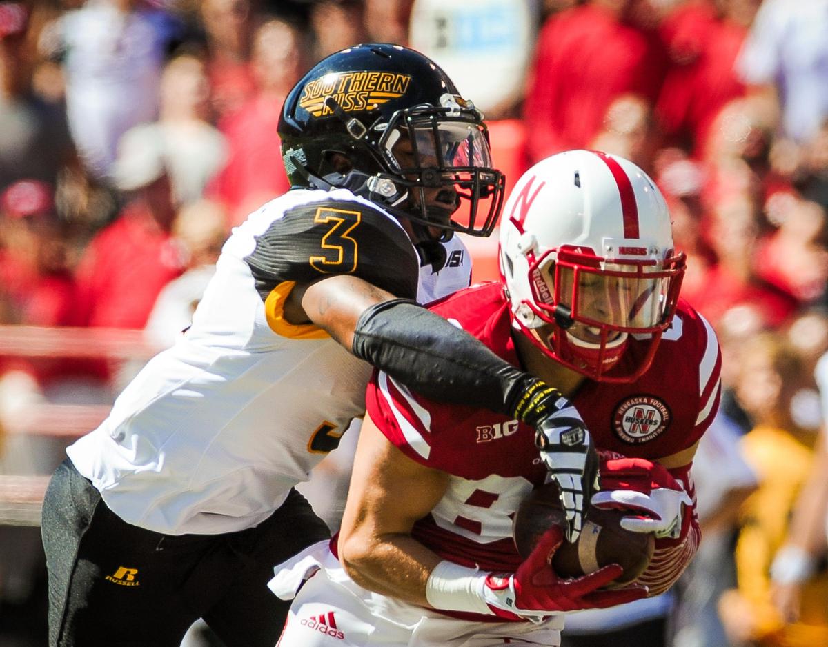 Wide receiver Brandon Reilly, No. 87 of the Nebraska Cornhuskers, catches a ball over defensive back Cornell Armstrong, No. 3 of the Southern Miss Golden Eagles, during their game at Memorial Stadium on September 26, 2015, in Lincoln, Nebraska.