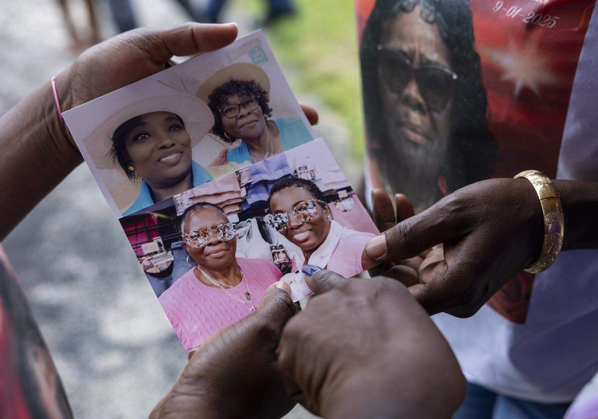 Photos of the late Doreen Richards Broadbelt, top right and bottom left, and her coworker, Emanie Saintidor, are shared at her vigil at her home on Tuesday, Sept. 9, 2025, in Miami Gardens, Fla. Broadbelt, 71, was walking to her job at Walmart when a dog attacked and fatally mauled her near her home on Labor Day, police said.
