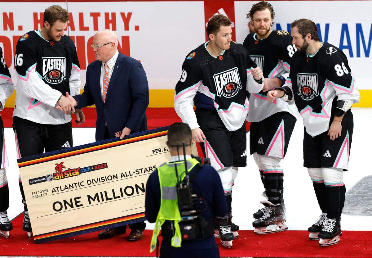 Atlantic Division’s Matthew Tkachuk (19), in the middle, celebrates with teammates after winning the MVP and the team winning the NHL All-Star Game at FLA Live Arena in Sunrise, Florida on Saturday, February 4, 2023.