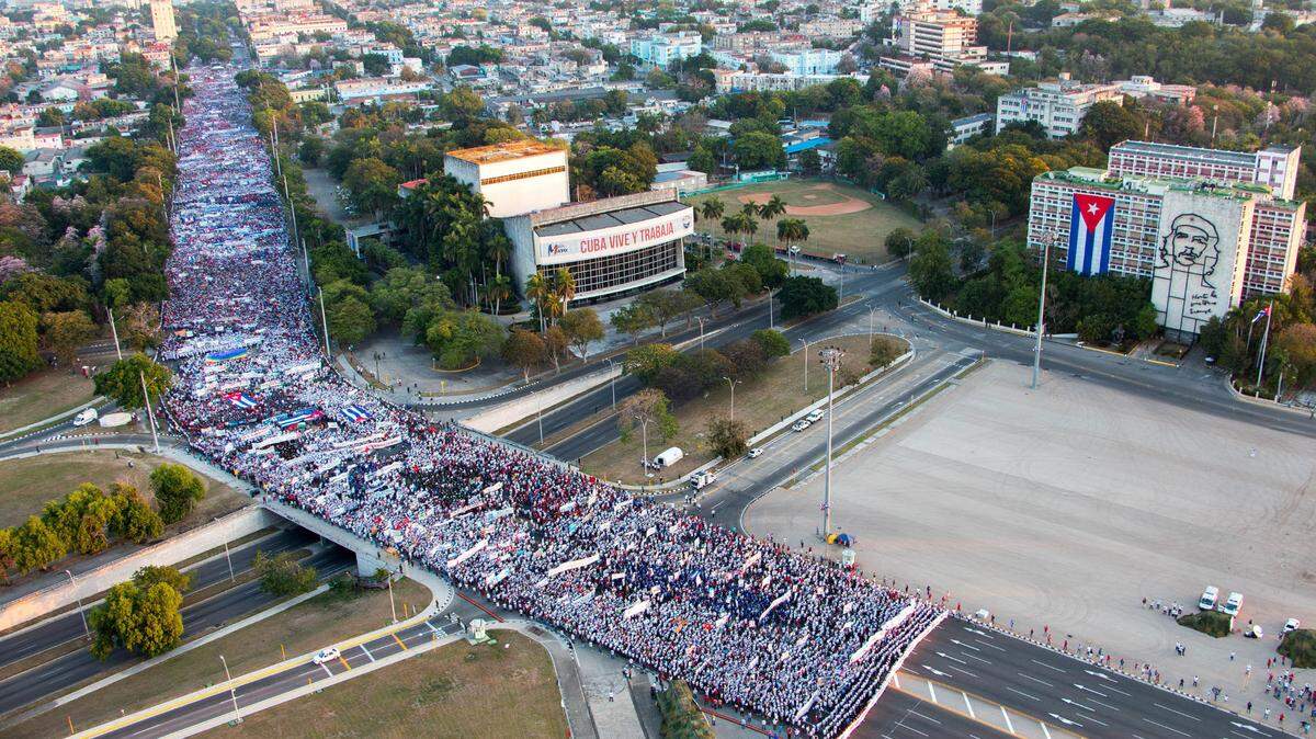 Cubans participate in the traditional May Day parade at the Revolution Square in Havana on May 1, 2022. The parade was canceled this year because of the country’s gasoline crisis.