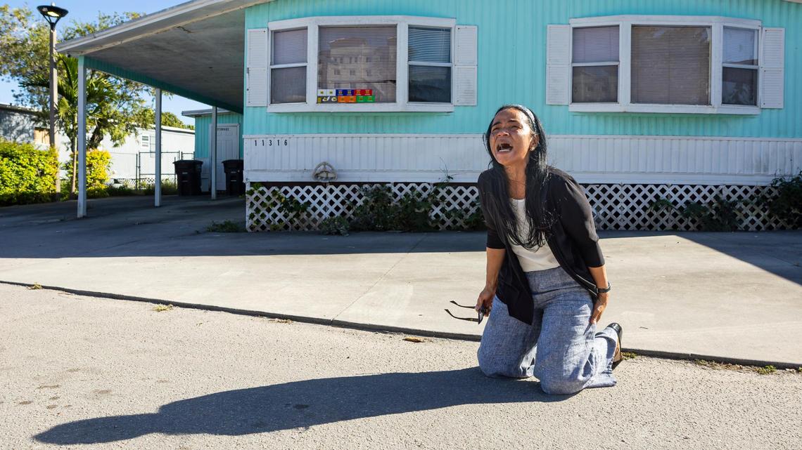 Marisol Sanchez, 55, cries in front of her former home at the Li’l Abner Mobile Home Park on Friday, March 7, 2025, in Sweetwater, Fla. She shared that her husband, Diego Valdes, who owned the mobile home and was in poor health, felt pressured by the park ownership to sell it for $14,000. He passed away from a heart attack the next day, she said.
