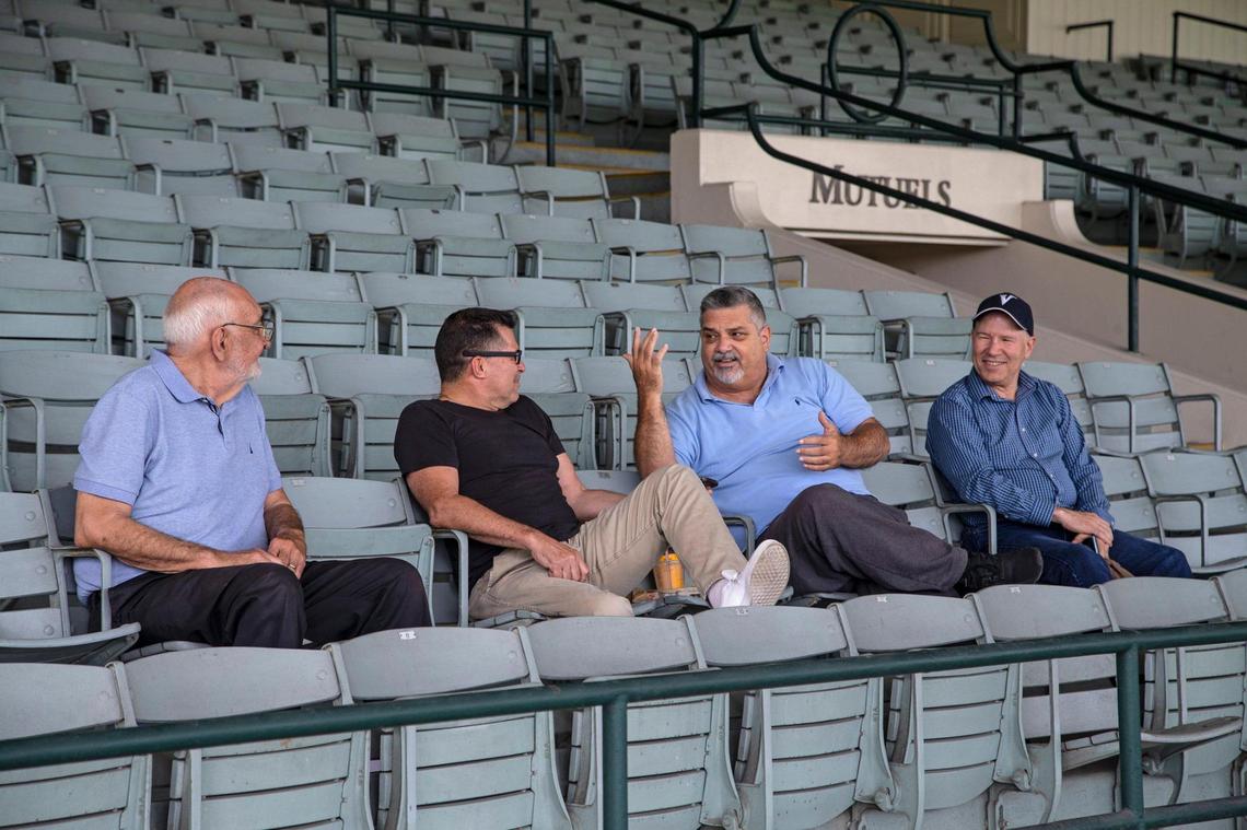 From left, Rolando Acosta, Jose Gomez, Carlos Lima and Gus Treichel get together at Hialeah Park Racing & Casino on Saturday, May 16, 2021. They meet once a week to catch up on their daily lives and tell stories.