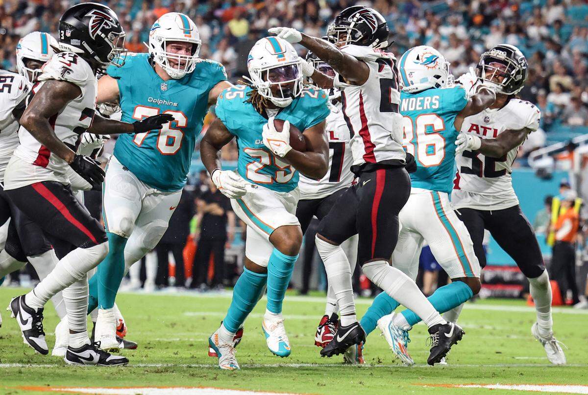 Miami Dolphins running back Jaylen Wright (25) scores against the Atlanta Falcons in the second quarter at Hard Rock Stadium, in Miami Gardens, Florida on Friday, August 9, 2024.