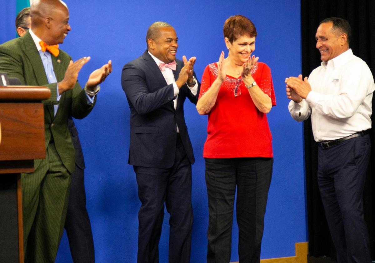 Miami-Dade County Vice Chairman Oliver Gilbert III applauds with Commissioners Keon Hardemon, Rebeca Sosa and Joe Martinez following a special county commission meeting Tuesday, June 8, 2021, to address the recent gun violence in the county. At the meeting County Mayor Daniella Levine Cava won unanimous support for her nearly $8 million Peace and Prosperity Plan to boost summer jobs for teens, with a focus on teens with criminal records.