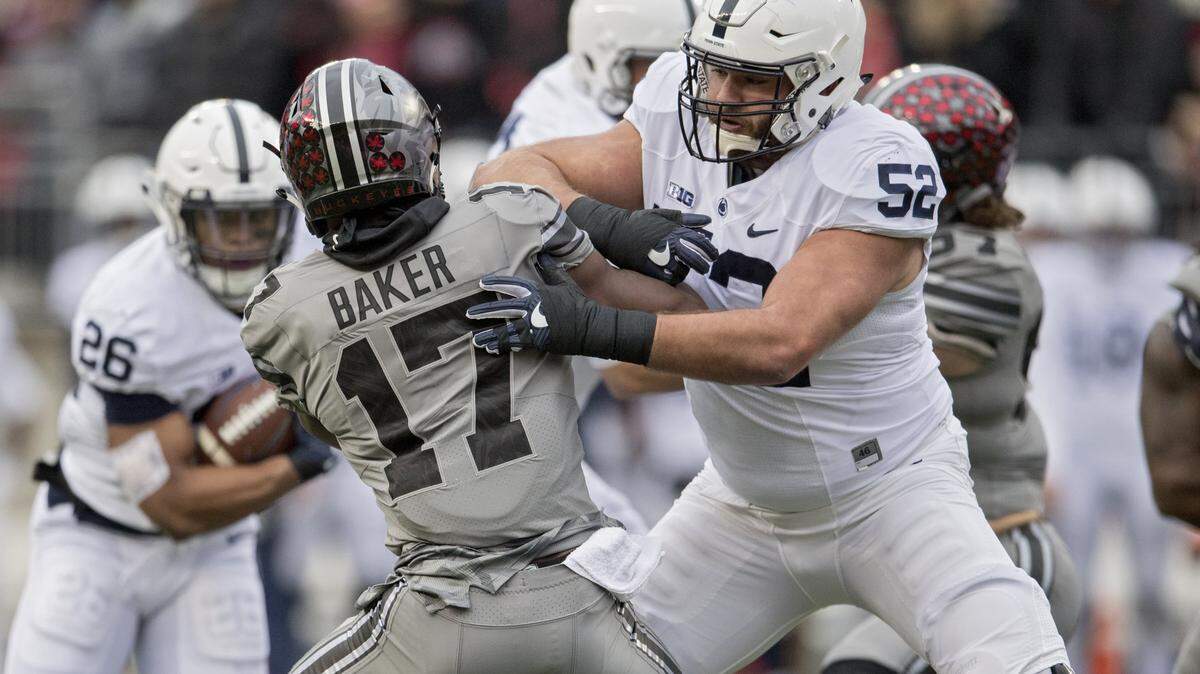 Penn State defensive tackle Curtis Cothran blocks Ohio State linebacker Jerome Baker during the game on Saturday, 28, 2017 at Ohio Stadium.  Penn State lost, 39-38.  The Dolphins drafted Baker 73rd overall on Friday.